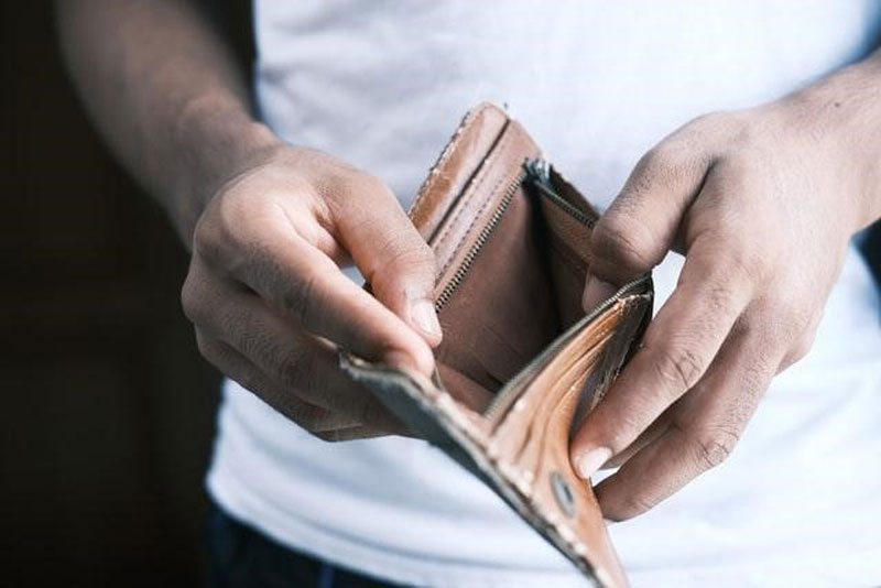 A man holding an empty wallet.