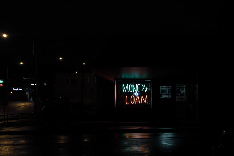 A sign that reads MONEY AND LOANS.