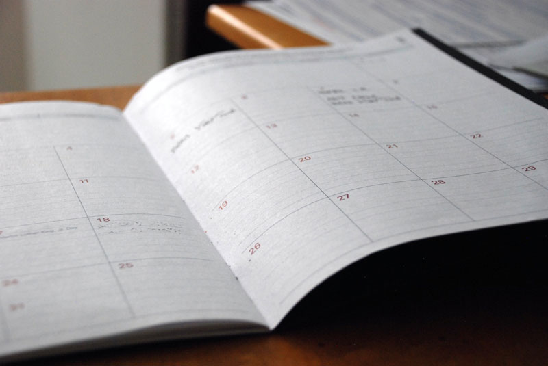 An open notebook calendar.